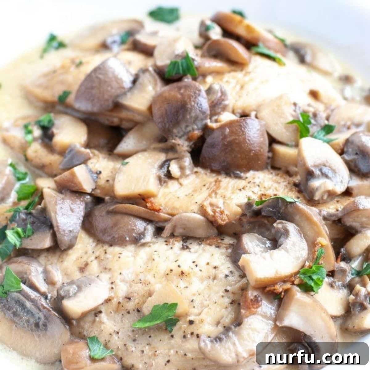 31 Effortless Friday Feasts for a Relaxing Night In 22 Plate of chicken marsala with mushrooms.