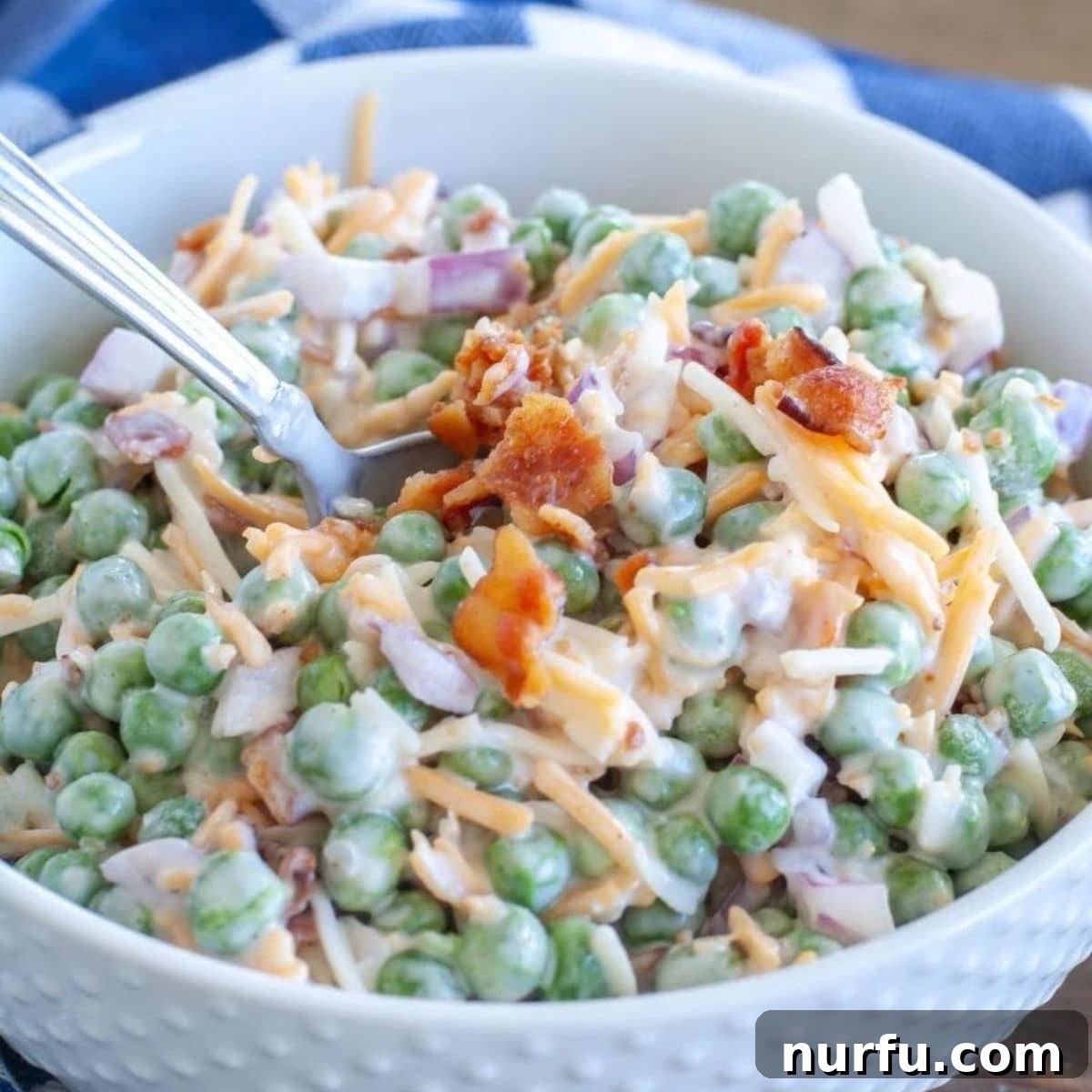 Perfect Pairings for Your Chicken Wings 22 Bowl of pea salad with chopped bacon.