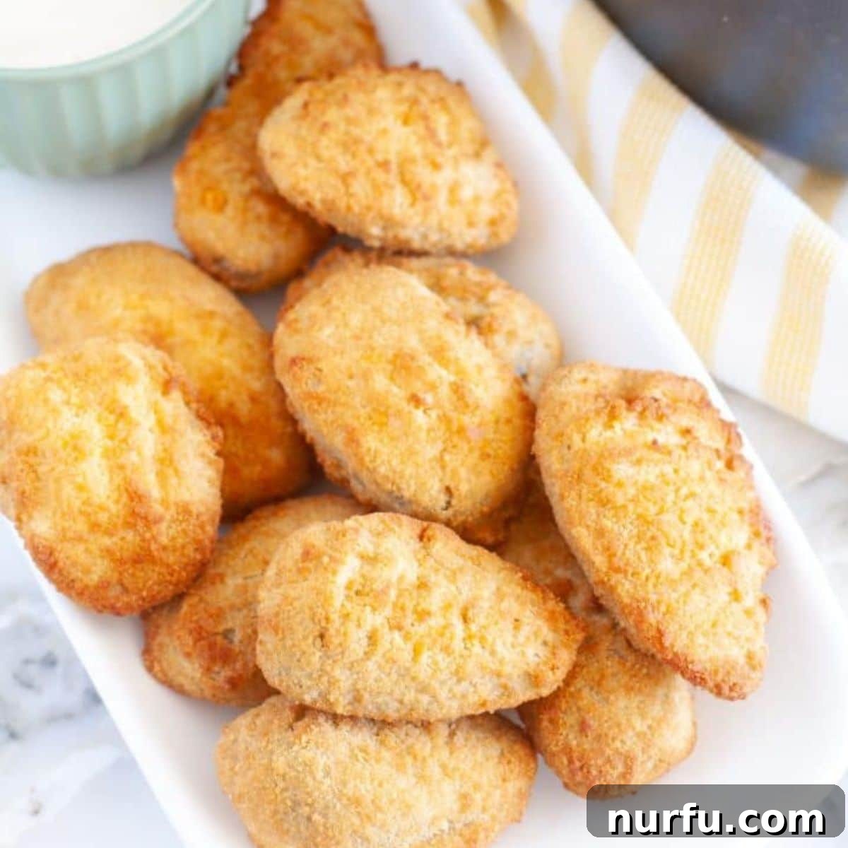 Perfect Pairings for Your Chicken Wings 23 Fried jalapeno poppers on a plate.