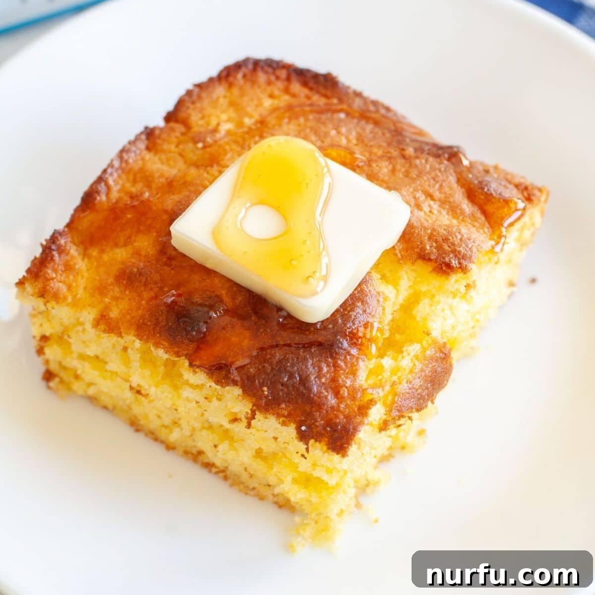 Perfect Pairings for Your Chicken Wings 4 Piece of cornbread topped with pat of butter.