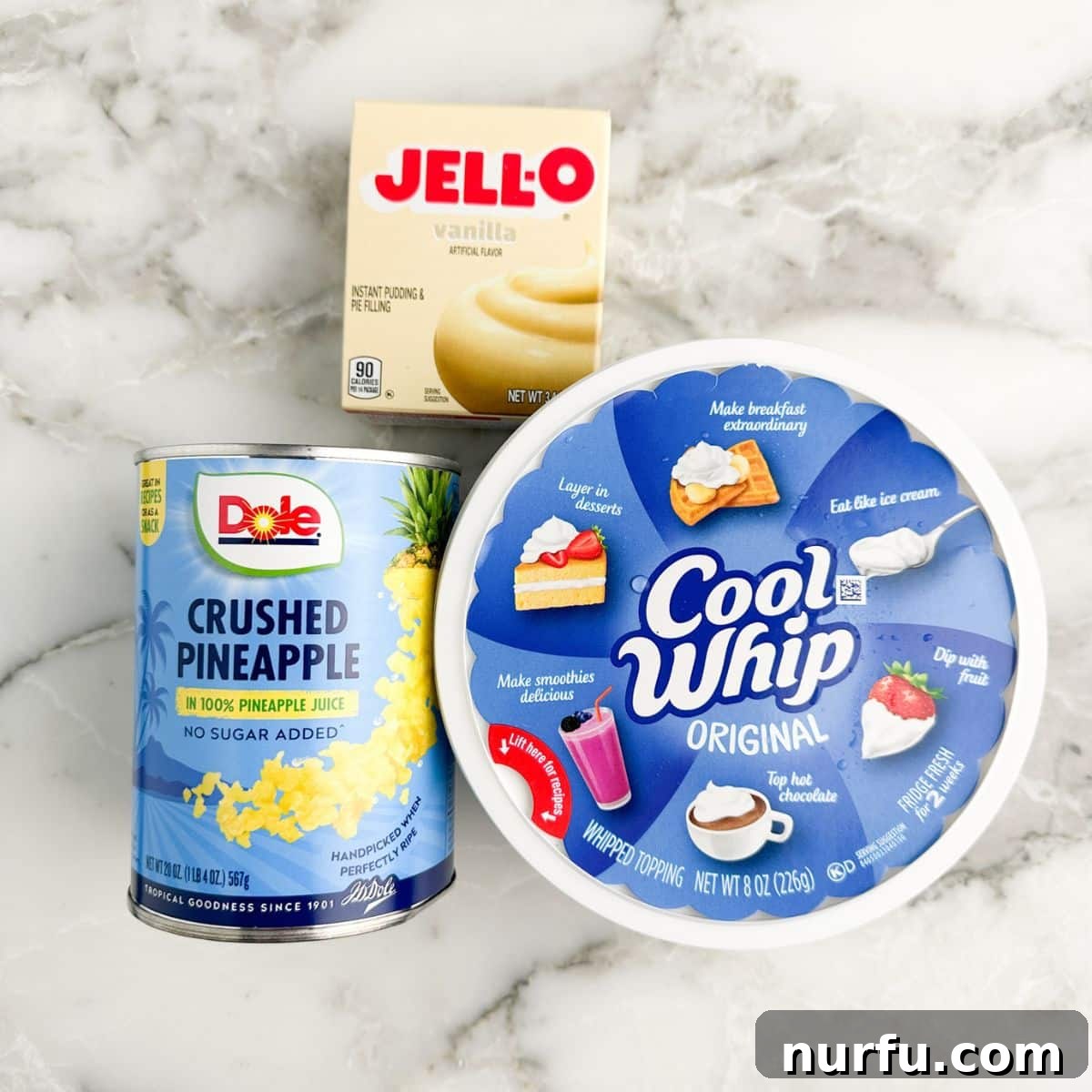 Box of vanilla pudding mix, can of crushed pineapple, and Cool Whip, showcasing the three simple ingredients for pineapple pudding.