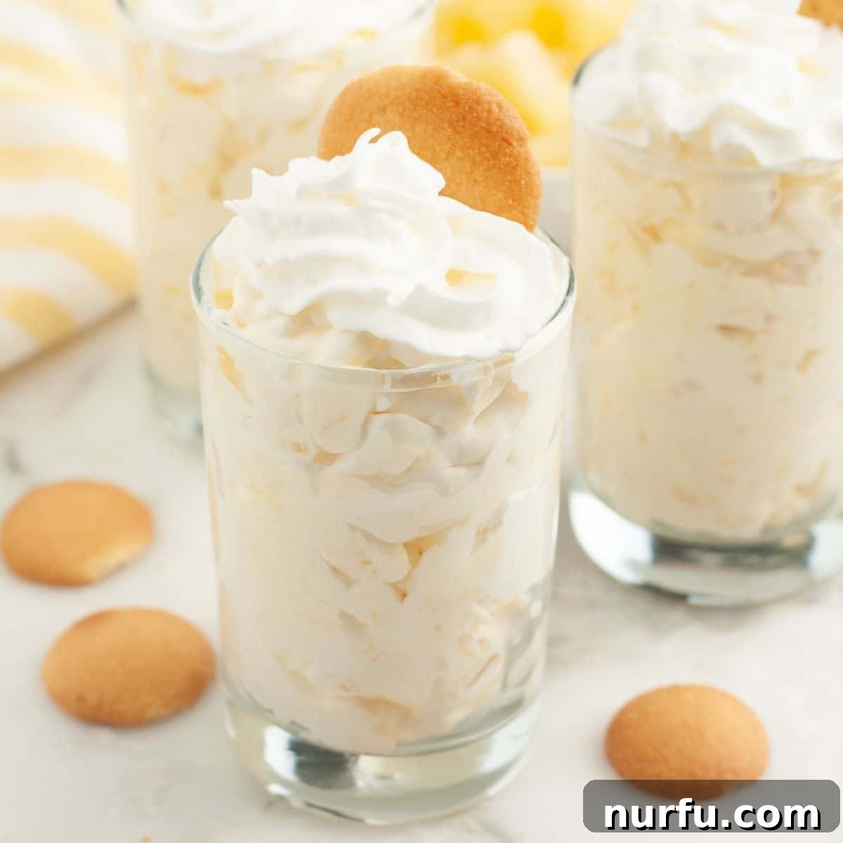 Small glass filled with pineapple pudding, ready to be enjoyed as a simple yet elegant dessert.