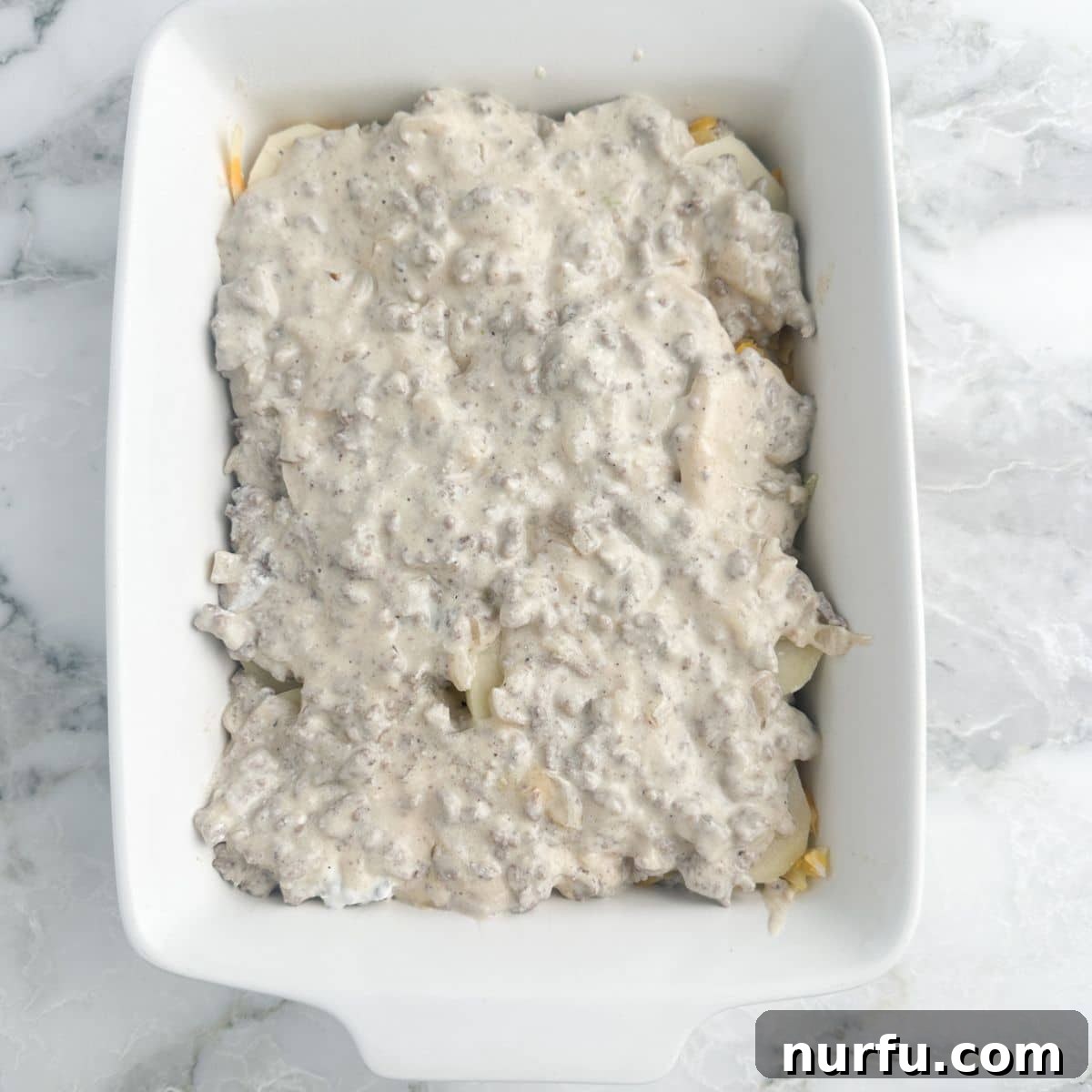 Creamy Stroganoff Potato Casserole 6 Layer of ground beef stroganoff mixture over potatoes.