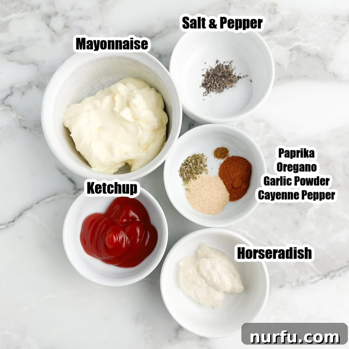 Signature Bloomin' Onion Sauce 3 A collection of fresh ingredients for Bloomin' Onion Sauce including mayonnaise, ketchup, prepared horseradish, paprika, garlic powder, oregano, salt, pepper, and cayenne pepper, neatly arranged in separate bowls.