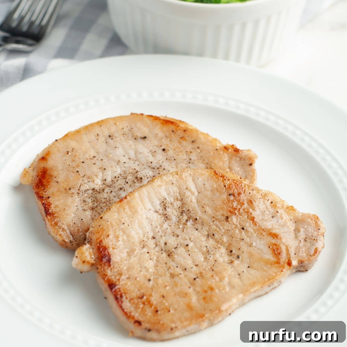 31 Perfect Side Dishes for Potato Salad 7 Thin pork chops on a plate.