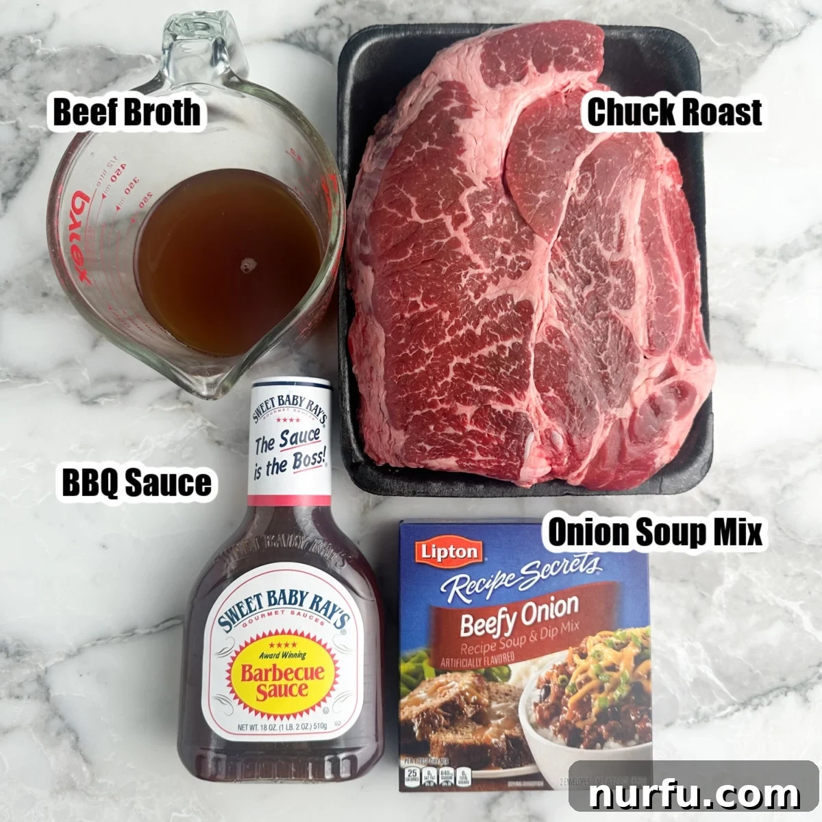 Fall Apart Slow Cooker BBQ Beef 3 The four essential ingredients for slow cooker BBQ beef: a raw chuck roast, a carton of beef broth, a bottle of barbecue sauce, and a packet of onion soup mix, neatly arranged on a kitchen counter.