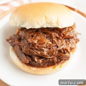 BBQ beef sandwich on a plate.