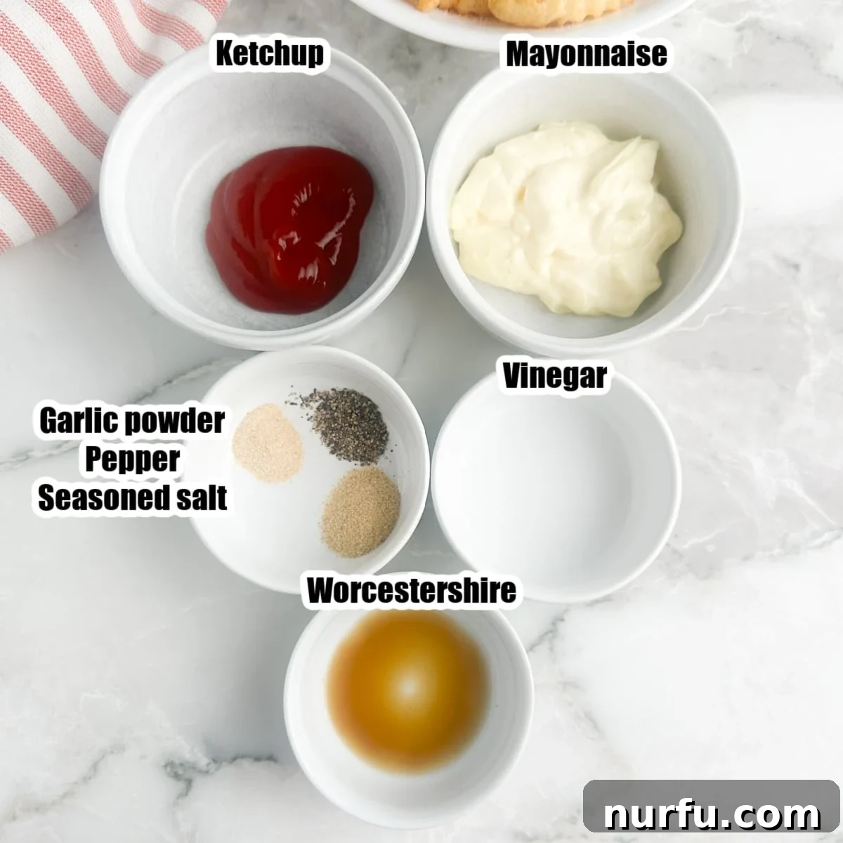 The Ultimate Homemade Zaxby Zax Sauce 3 All essential ingredients for homemade Zax Sauce laid out in individual bowls: ketchup, mayonnaise, vinegar, Worcestershire sauce, and various seasonings.