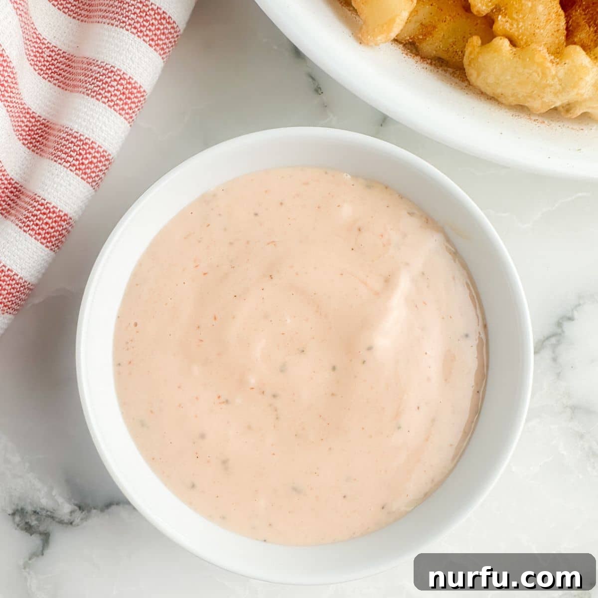 The Ultimate Homemade Zaxby Zax Sauce 5 A bowl of freshly whisked, creamy Zax Sauce, perfectly smooth and ready to be served or chilled.
