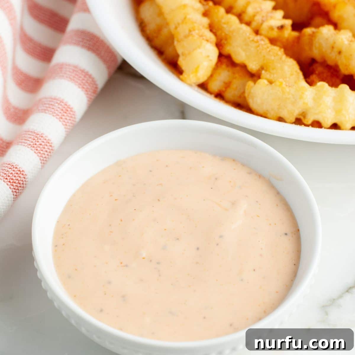 The Ultimate Homemade Zaxby Zax Sauce 6 A bowl of rich, creamy fry sauce, perfectly showcasing its appetizing texture and color, ready to be enjoyed.