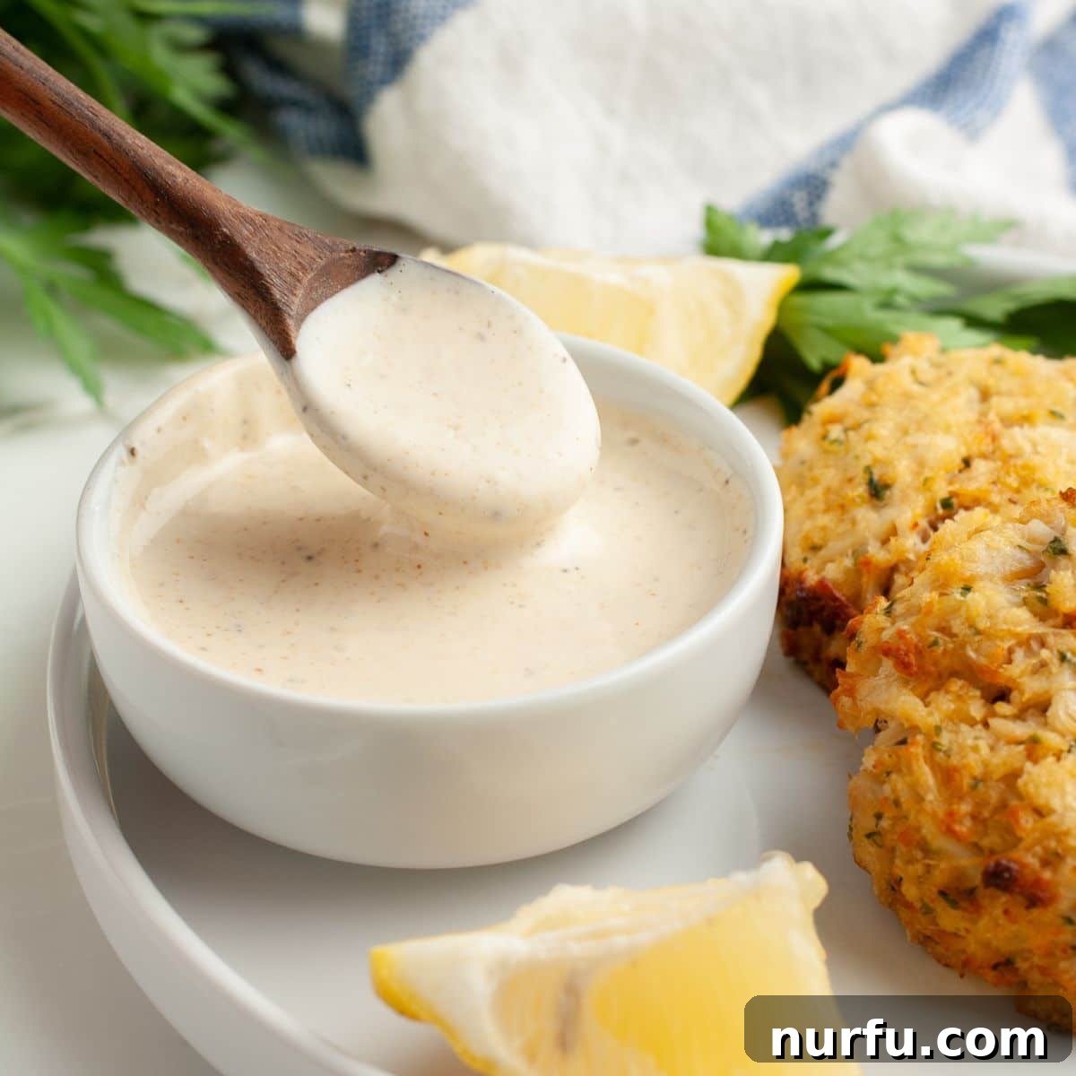 Homemade Crab Cake Sauce Perfection 2 Bowl of crab cake sauce with crab cakes, ready to be served.