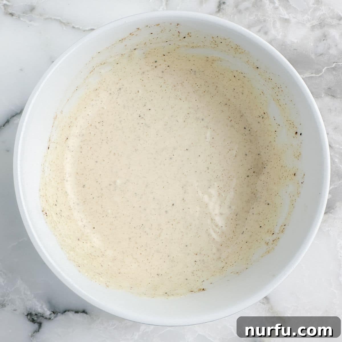 Homemade Crab Cake Sauce Perfection 5 A bowl of perfectly blended, creamy crab cake sauce, ready to serve.