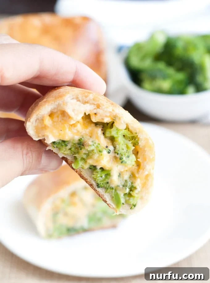 Homemade Chicken Broccoli and Cheese Pockets Homemade Chicken Broccoli and Cheese Pockets cut open, showing the rich filling