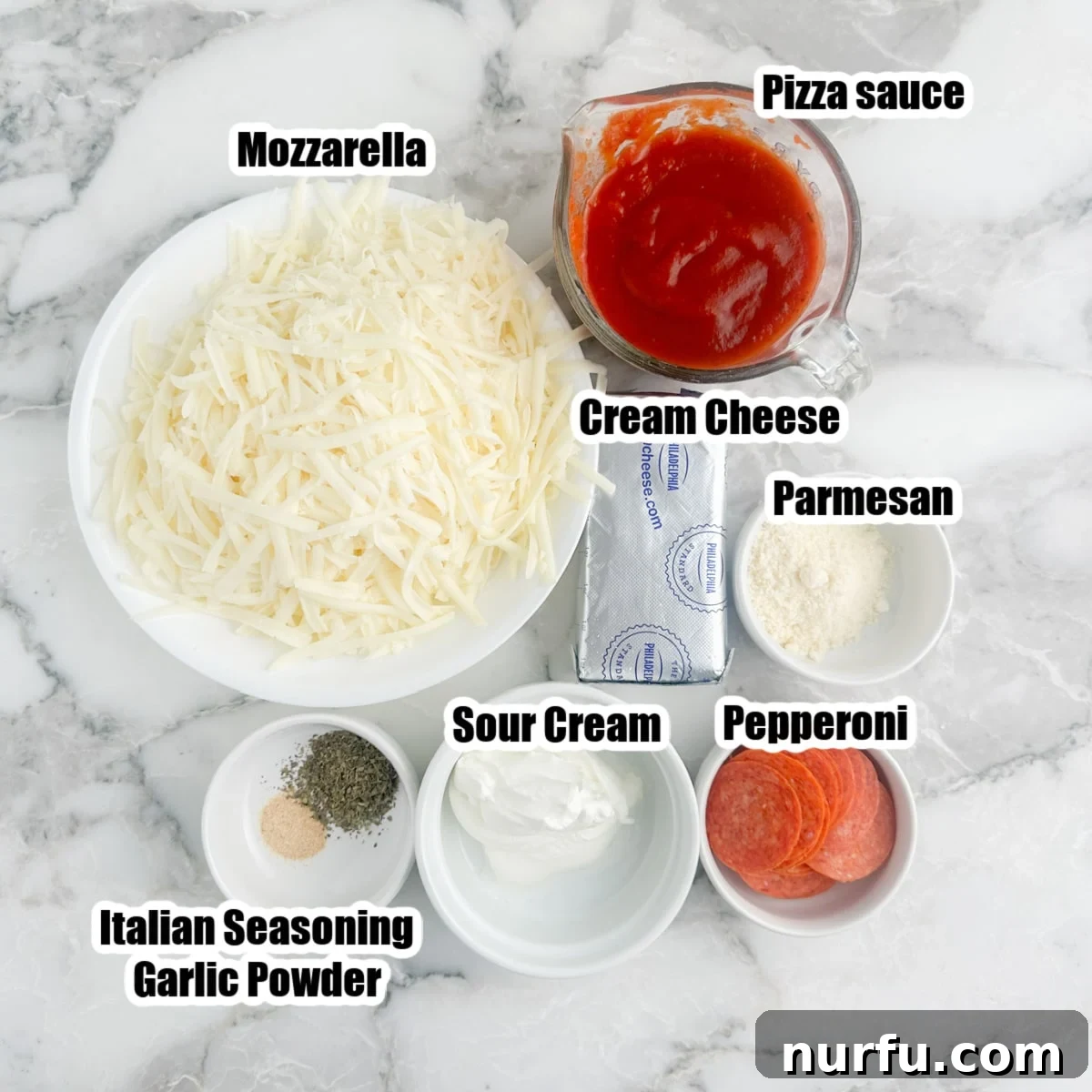 Ultimate Party Pizza Dip 3 Individual bowls displaying key pizza dip ingredients: shredded mozzarella cheese, rich pizza sauce, sliced pepperoni, and creamy sour cream.