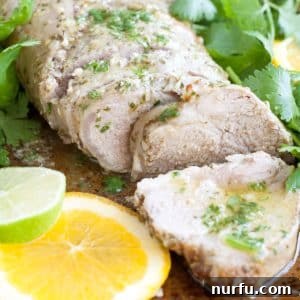 Citrus-Kissed Mojo Pork Tenderloin 2 Pork tenderloin with slice of orange and lime.