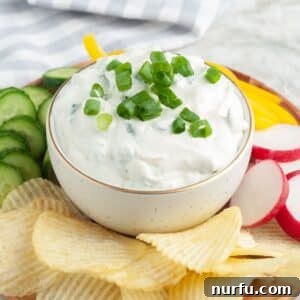 Savory Scallion Dip 7 Bowl of green onion dip with potato chips, radish, and sliced cucumbers.