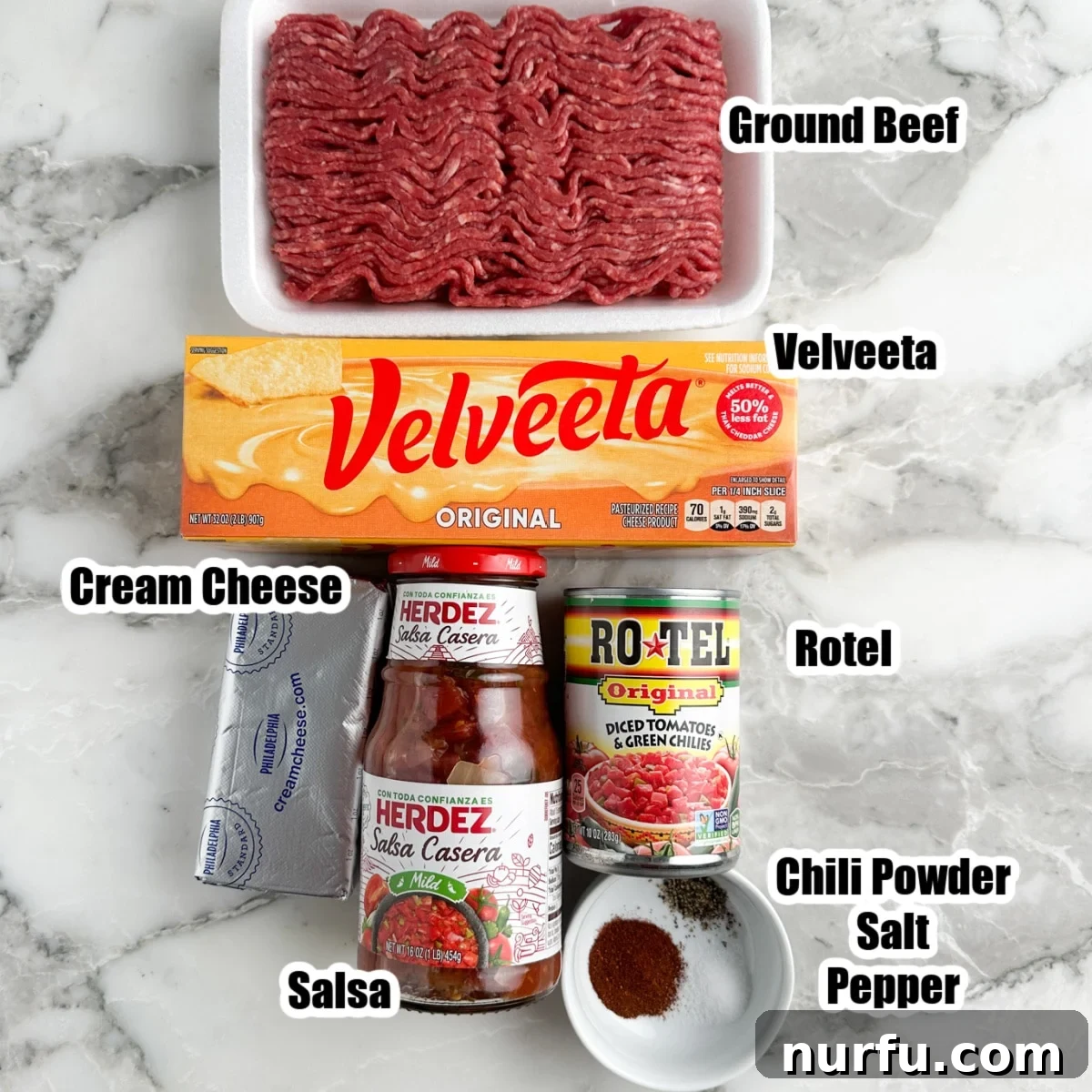 Savory Burger Dipping Sauce 3 A vibrant display of all the key ingredients for hamburger dip: ground beef, rich Velveeta and cream cheese, zesty salsa, and Rotel, along with essential seasonings.