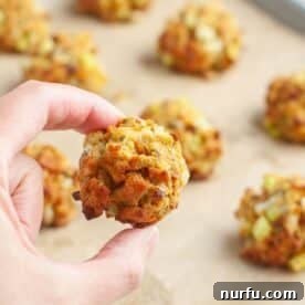 A hand presenting a perfectly formed, individual stuffing ball.