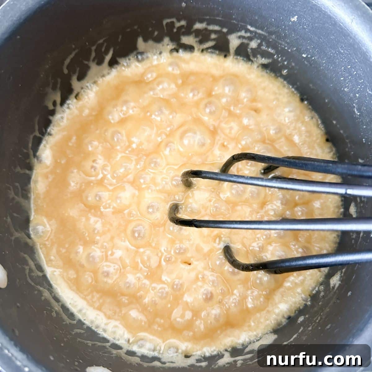 Cinnamon Caramel Saltines 6 Pot with boiling brown sugar and butter mixture for toffee.