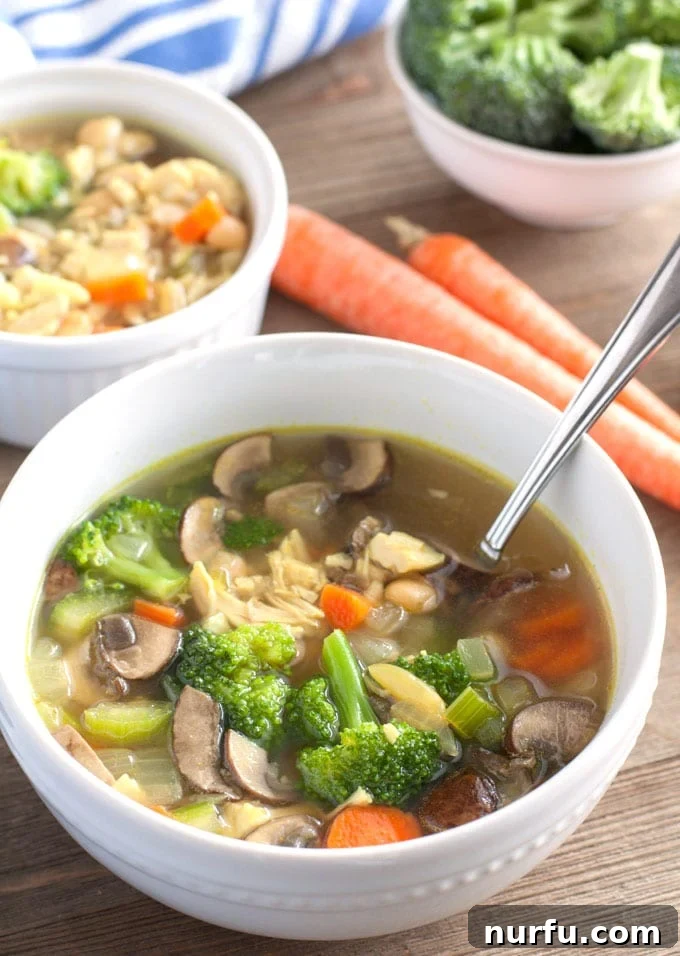 detox chicken soup detox chicken soup in a bowl with carrots and broccoli