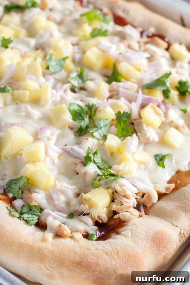 Sheet Pan BBQ Chicken Pizza: A Family Favorite Delicious sheet pan BBQ chicken pizza, freshly baked and ready to serve.