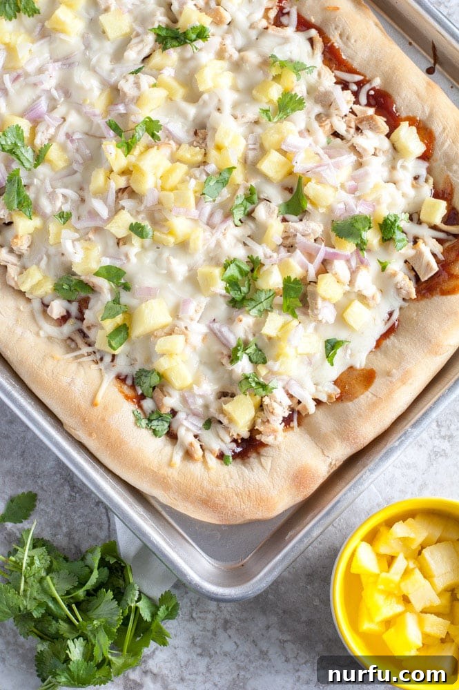 Fresh Ingredients for Your BBQ Chicken Pizza Diced pineapple and red onion, prepped for sheet pan pizza, in small bowls.