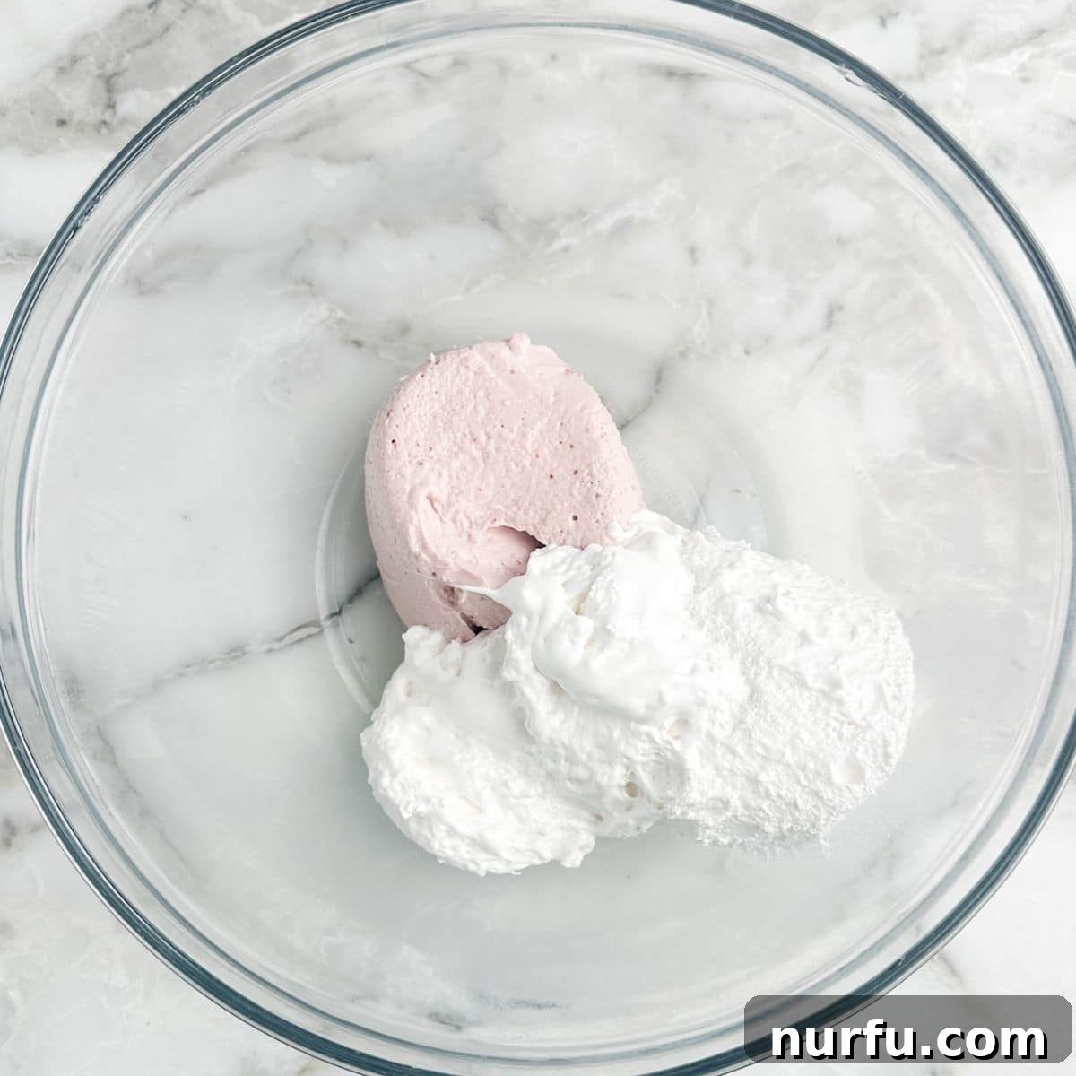Strawberry Bliss Dip 4 Softened strawberry cream cheese and marshmallow fluff in a mixing bowl.