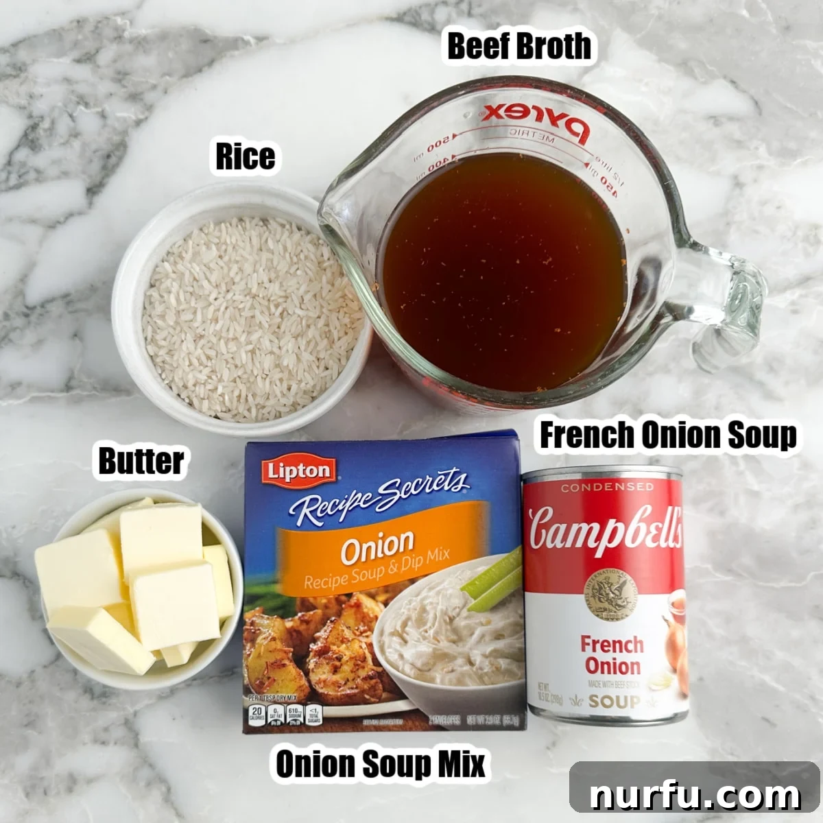 Caramelized Onion and Gruyere Rice 3 A collection of the five essential ingredients for French Onion Soup Rice: a bowl of long-grain white rice, a carton of beef broth, a packet of Lipton onion soup mix, a can of French onion soup, and a stick of butter.