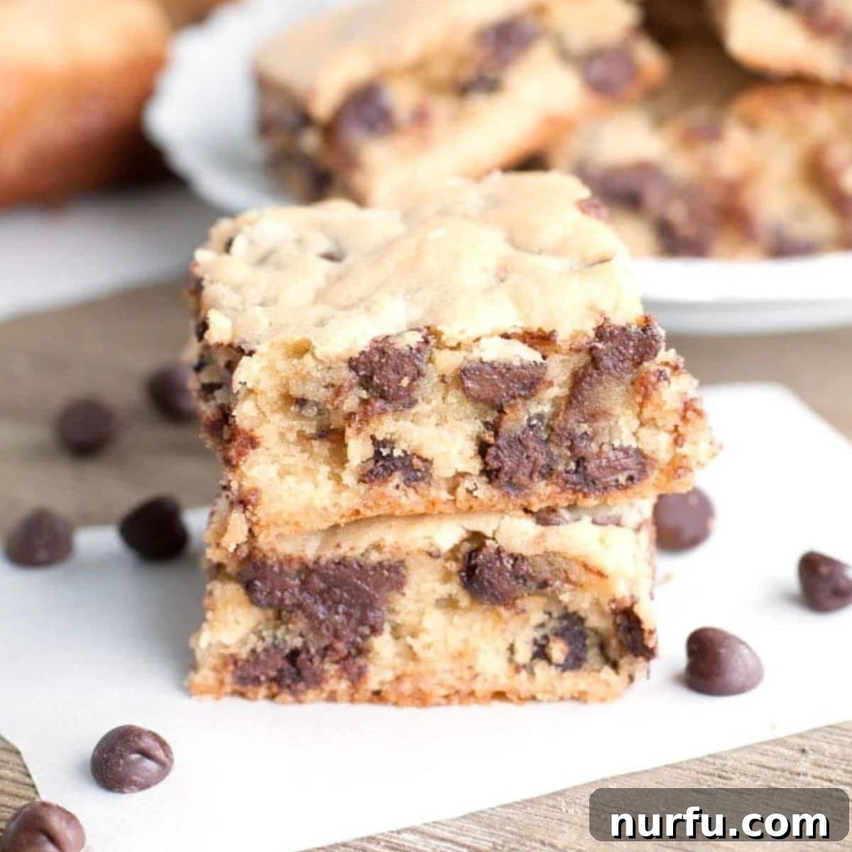 Congo Squares A beautifully arranged stack of golden chocolate chip cookie bars, showcasing their irresistible chewiness.