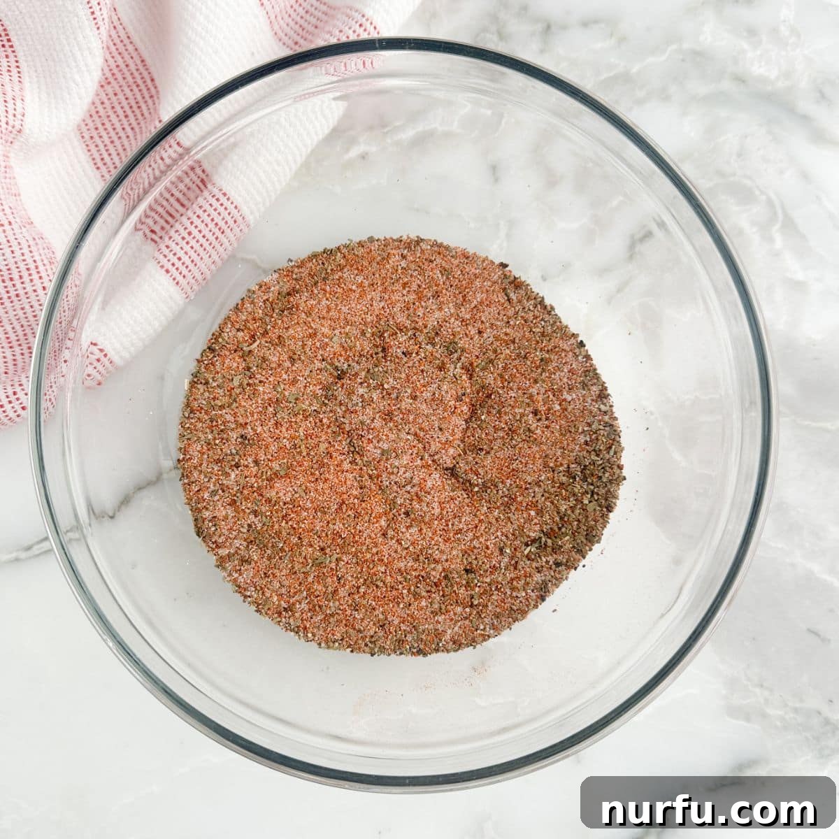 The Crimson Kitchen Blend 5 A smaller bowl brimming with the finished homemade Red Robin fry seasoning.