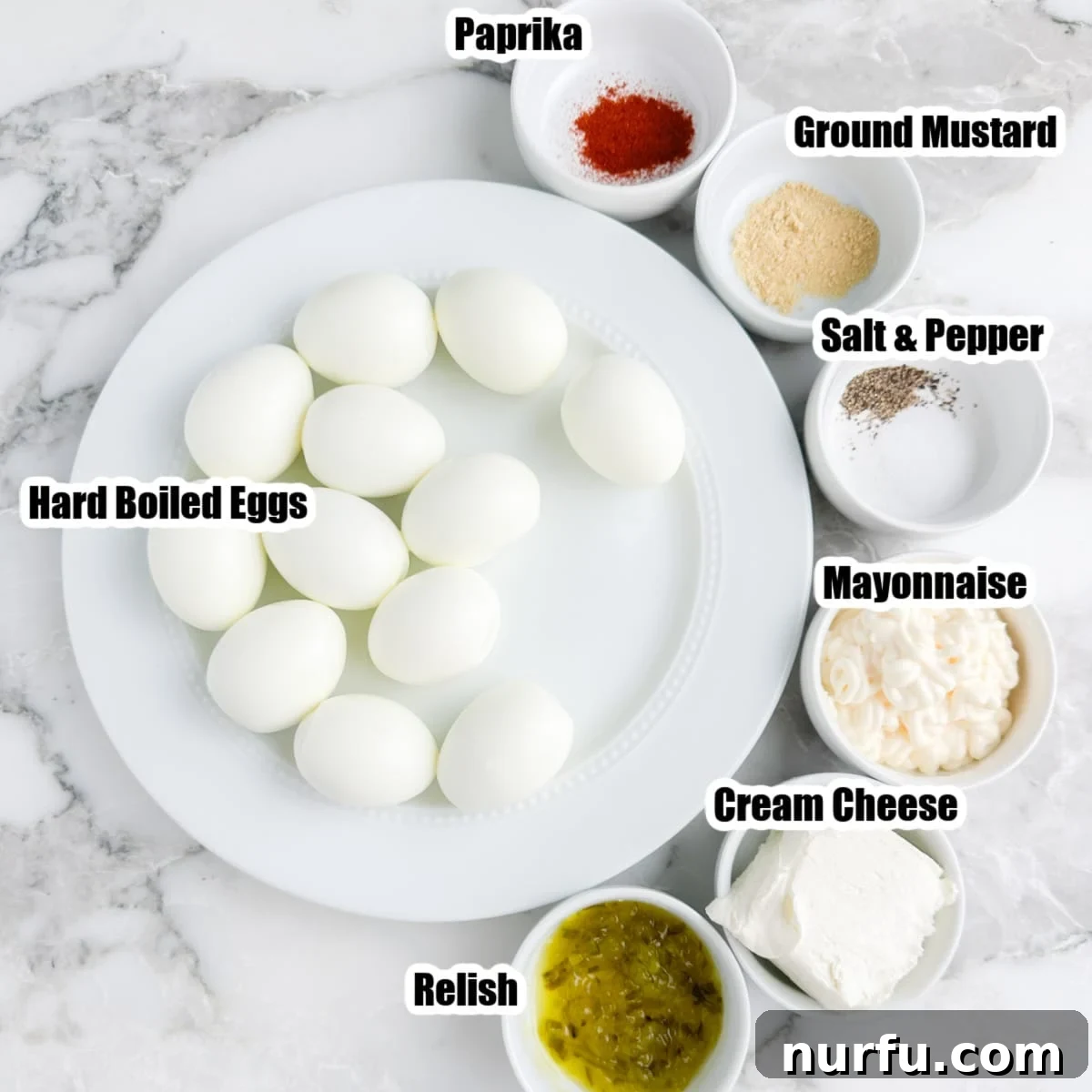Savory Whipped Egg Dip 3 A flat lay of fresh ingredients for making deviled egg dip: perfectly hard-boiled eggs, a bowl of relish, softened cream cheese, rich mayonnaise, and essential seasonings like paprika, salt, and pepper.