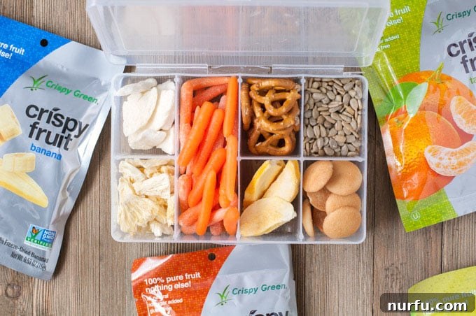 Assorted healthy snacks for a road trip in organized containers
