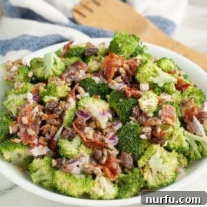 Vibrant Broccoli Raisin Bliss 7 A bowl of broccoli salad with raisins, ready to be served.