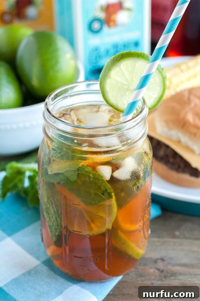 Mojito Sweet Tea Twist 2 Mojito Sweet Tea in a glass with lime and mint garnish