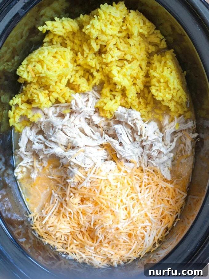 Crockpot Chicken and Rice Chicken, rice and cheese combined in slow cooker