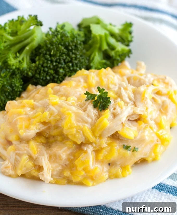 Crockpot Chicken and Rice chicken and rice on a plate with broccoli side