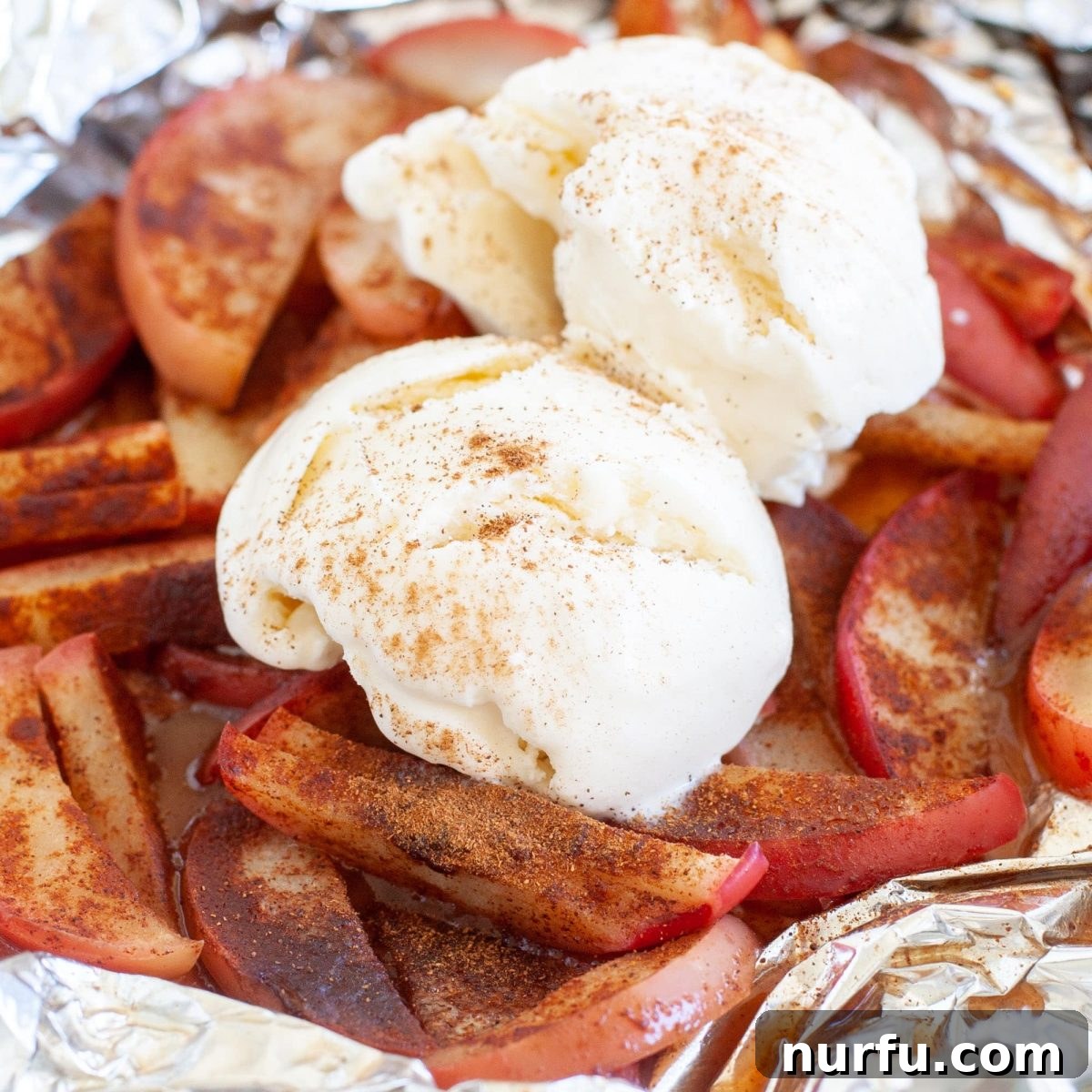 Savoring Freedom: 37 Delicious Memorial Day Recipes 28 Sweet and tender grilled apples with a scoop of melting ice cream, wrapped in foil for convenient cooking.