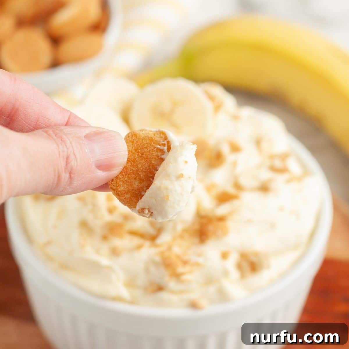 Savoring Freedom: 37 Delicious Memorial Day Recipes 31 A bowl of creamy banana pudding dip with wafers, a delightful twist on a classic dessert.