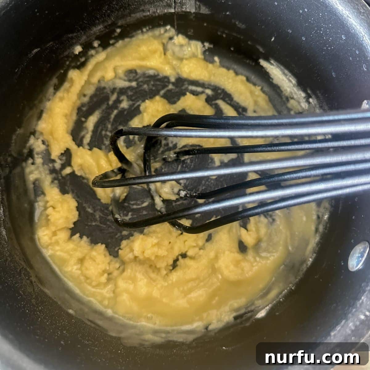Crispy Golden Chicken Croquettes 4 Butter melting in a saucepan, with flour ready to be whisked in for the roux.