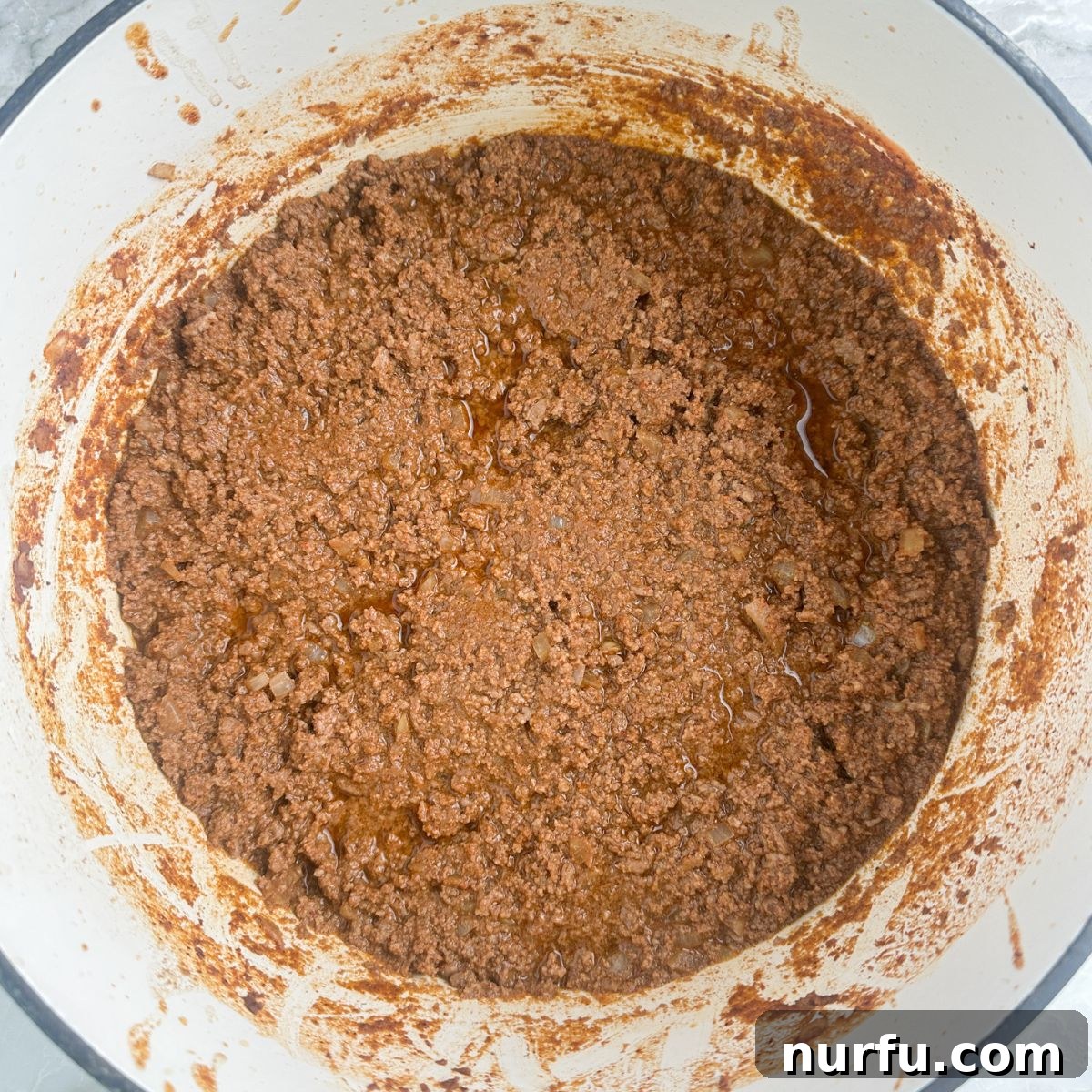 Ultimate Chili Dog Sauce 6 Pot of thick, rich hot dog chili simmering on the stove.