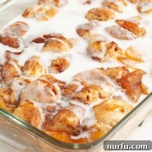 A beautifully baked Cinnamon Roll Peach Cobbler, golden and inviting.