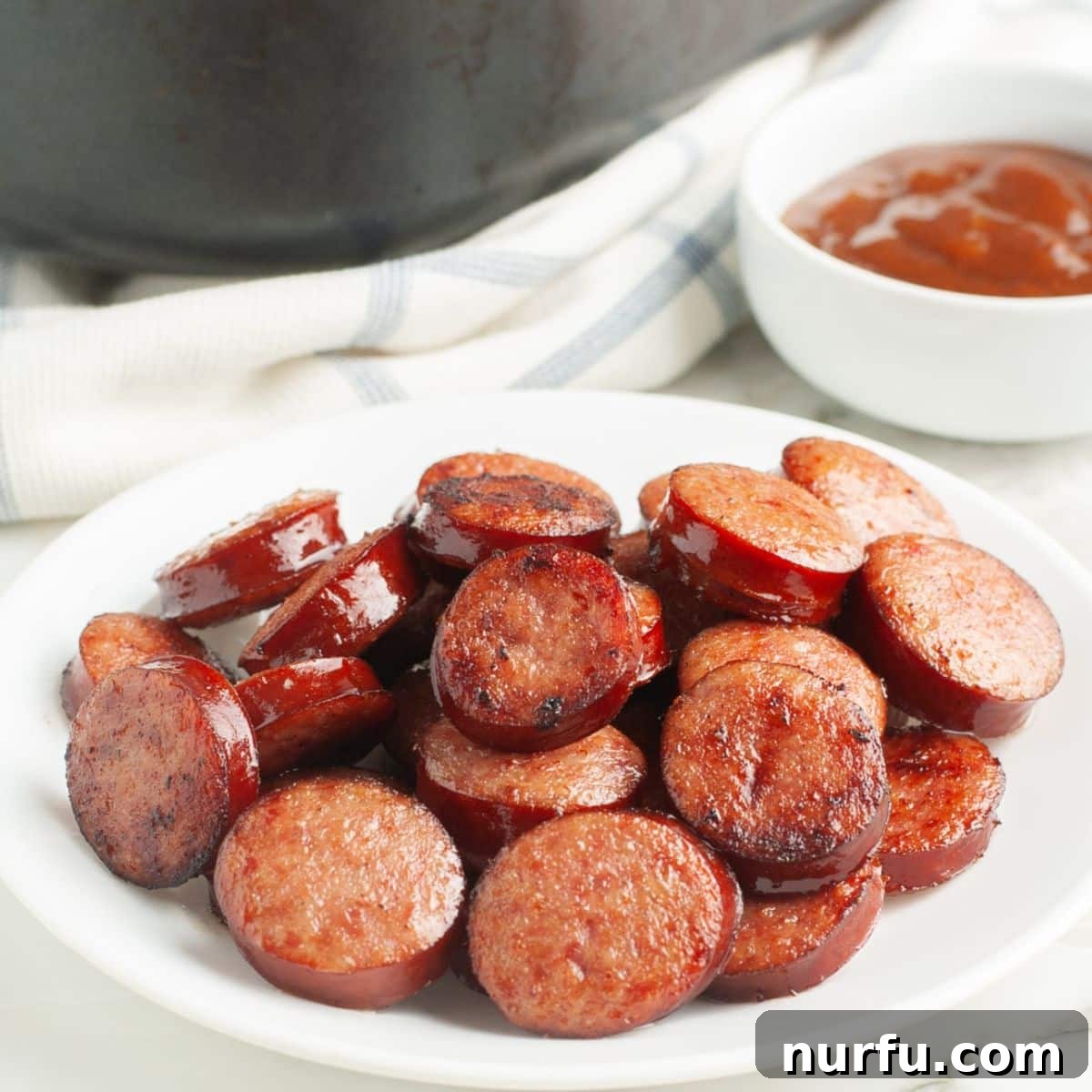 Crispy Air Fryer Kielbasa 7 Plate of perfectly cooked kielbasa rounds, ready to be enjoyed.