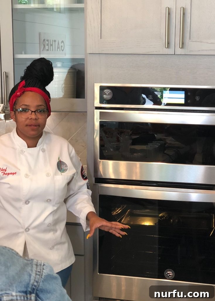 chef by oven Chef Tregaye next to a Whirlpool smart oven