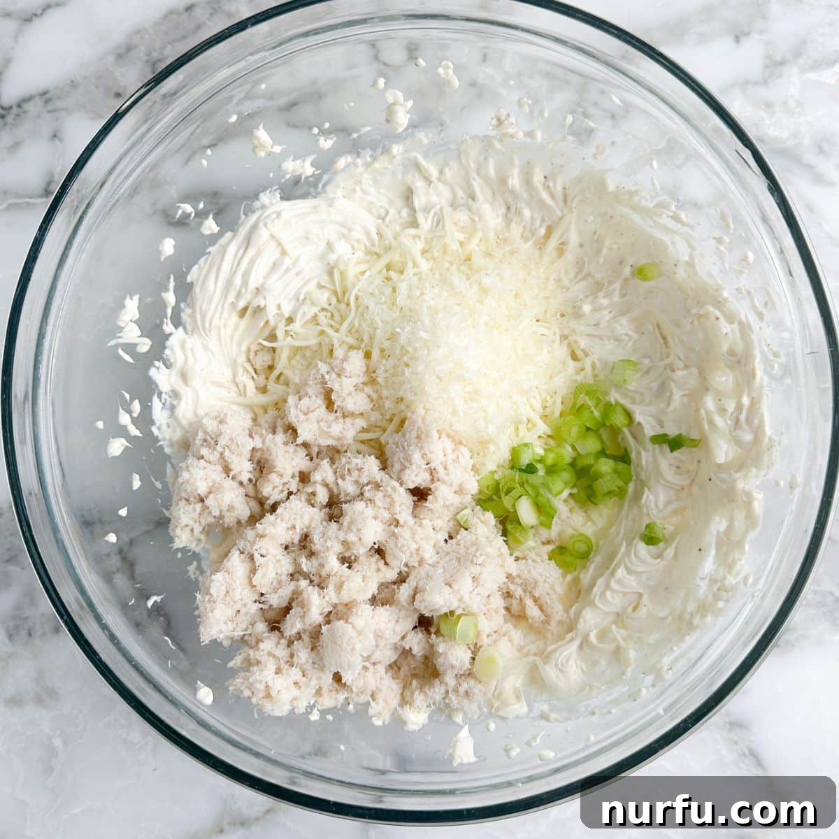 Irresistible Crab Rangoon Dip 4 Crab Rangoon Dip mixture in a bowl.
