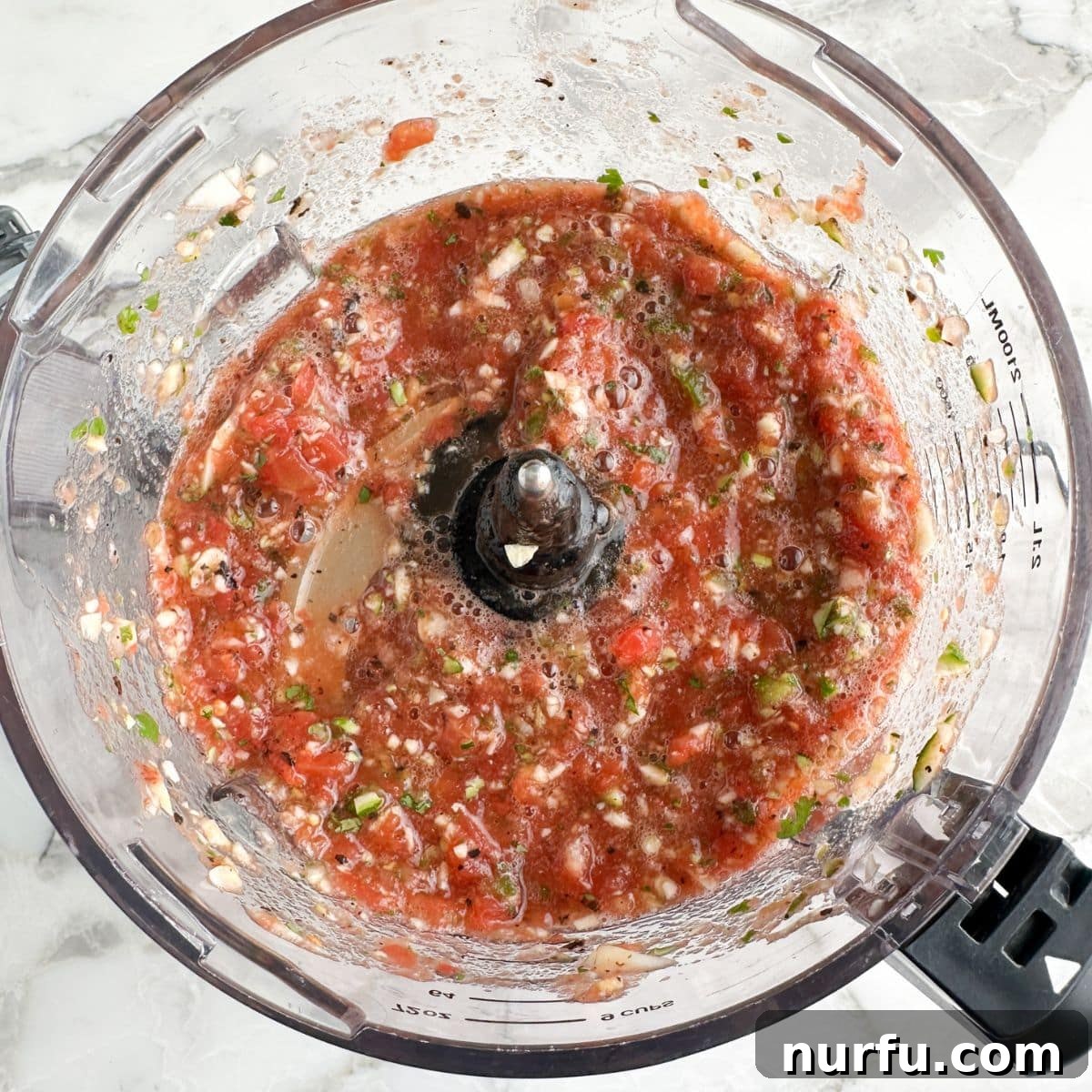 Zesty Zucchini Salsa 7 Finished zucchini salsa in a food processor, perfectly blended to a chunky consistency, ready to be served.