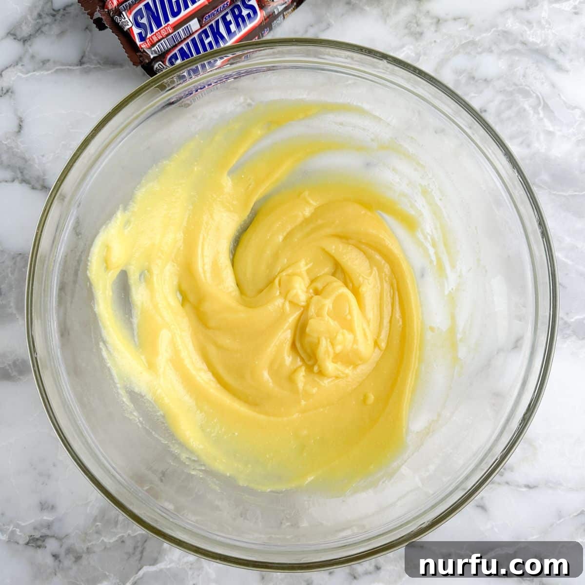 Snickers Caramel Apple Dream 4 Bowl of vanilla pudding being whisked until creamy.