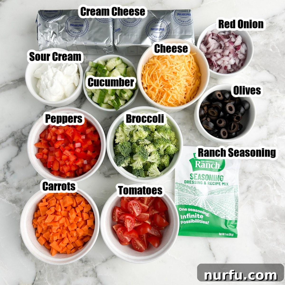 Garden Fresh Pizza Dip 3 Cream cheese, bowl of sour cream, ranch seasoning, bowls of diced vegetables.