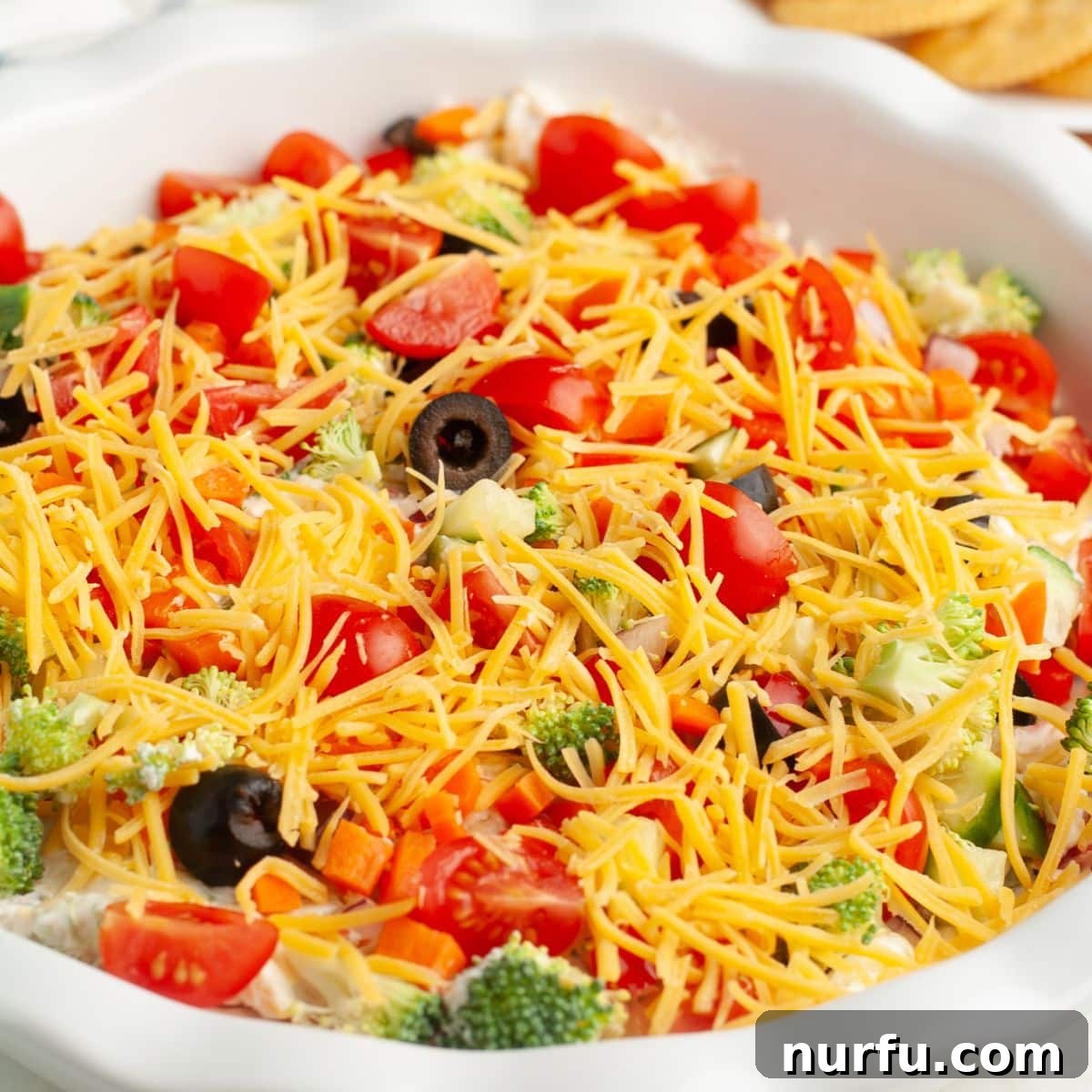 Garden Fresh Pizza Dip 8 Baking dish with veggie pizza dip.