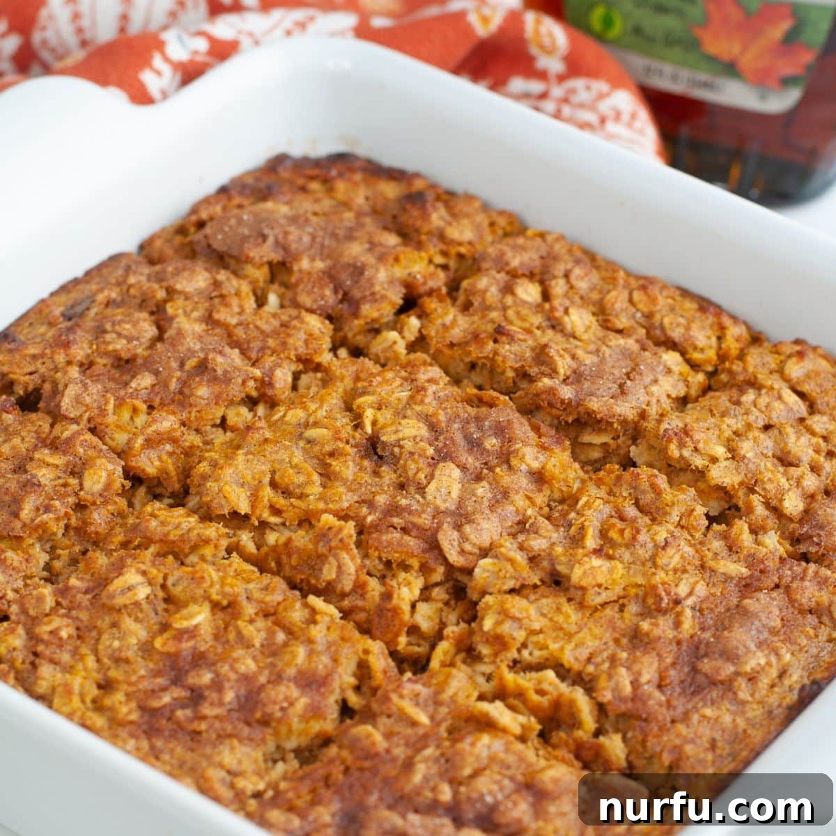 Warm Pumpkin Spice Baked Oatmeal 2 Baking dish with freshly baked pumpkin oatmeal, ready to be served for a cozy fall breakfast.