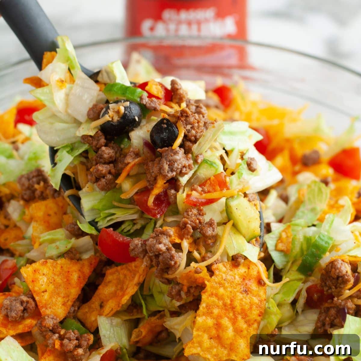 Catalina Kicked Taco Salad 2 Spoonful of vibrant taco salad with Catalina dressing.